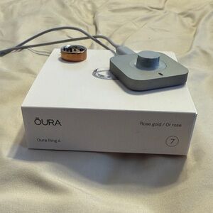 Oura Rose Gold Ring with Charger, Size 7. Excellent condition!